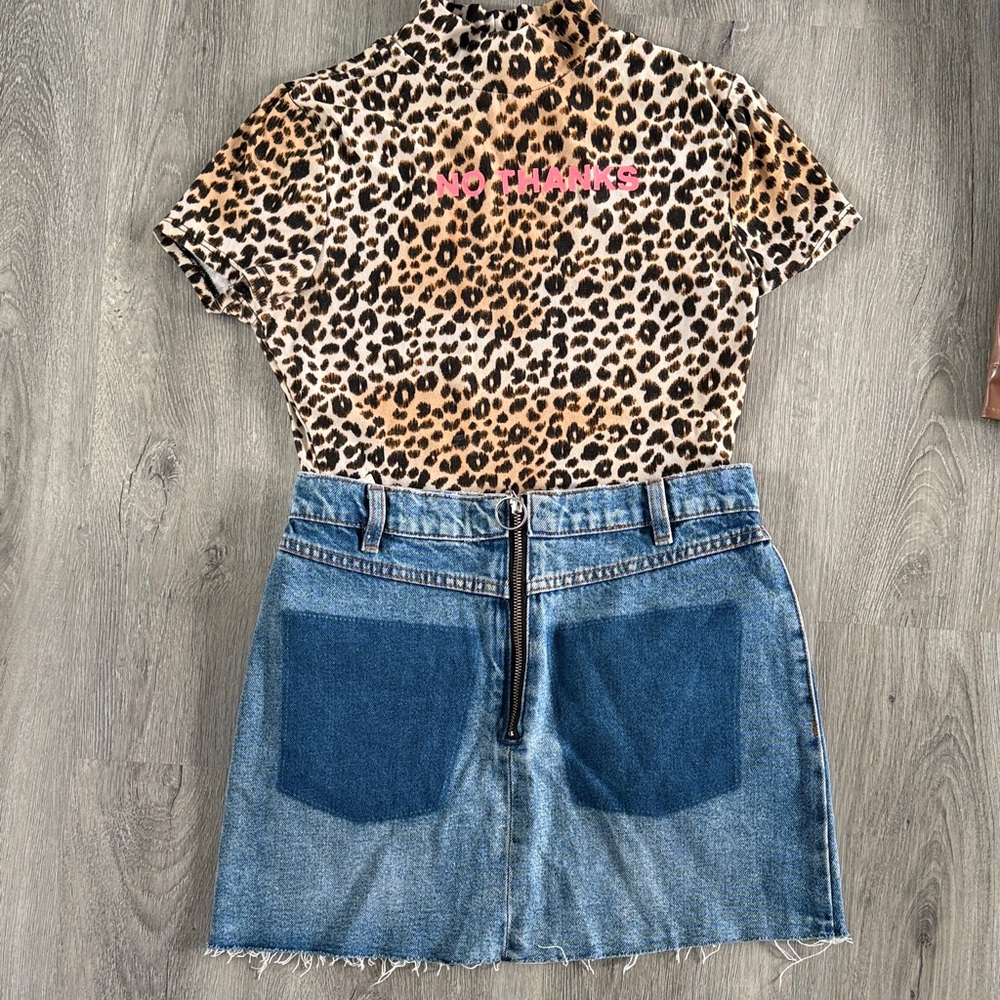 Jean skirt with detachable red fur pockets.